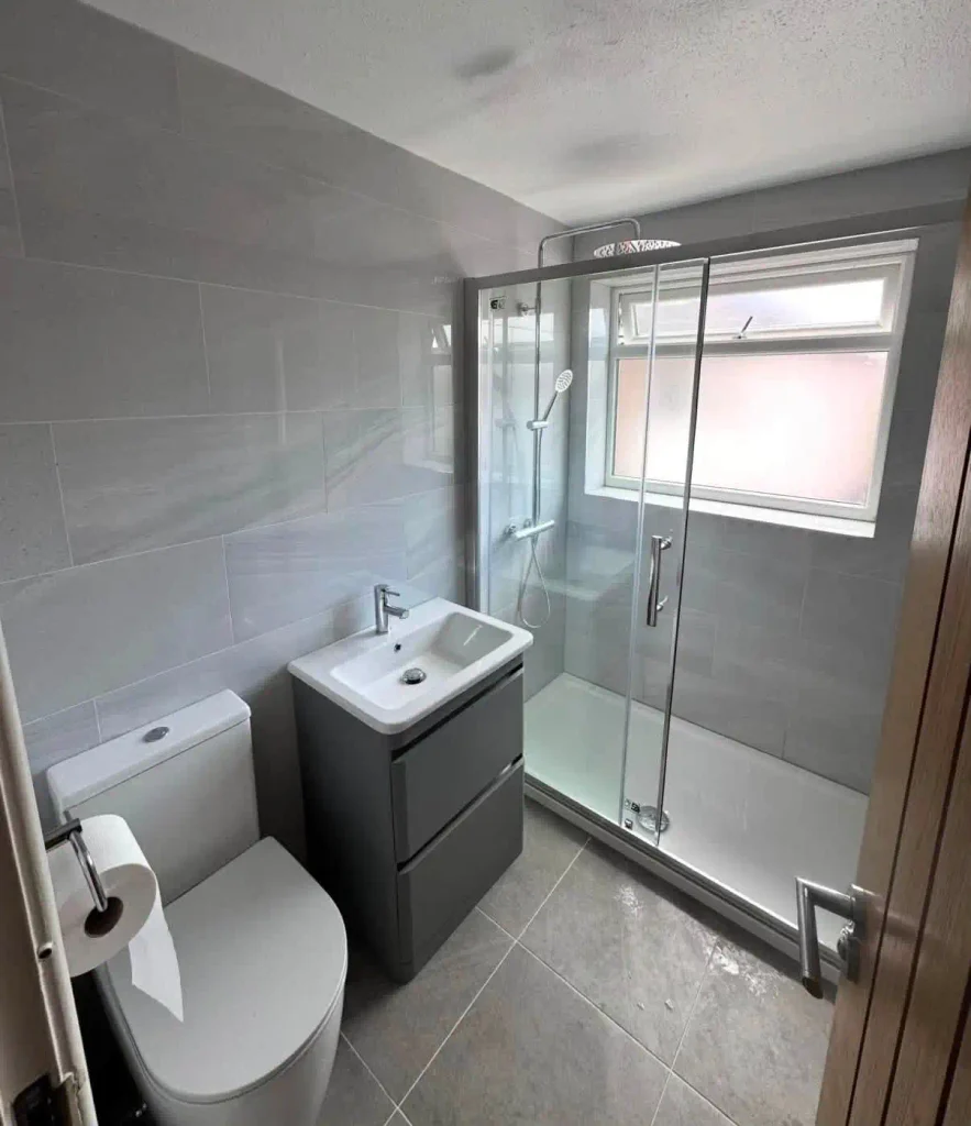 Bathroom suite installation with WC, Basin and walk-in shower with screen