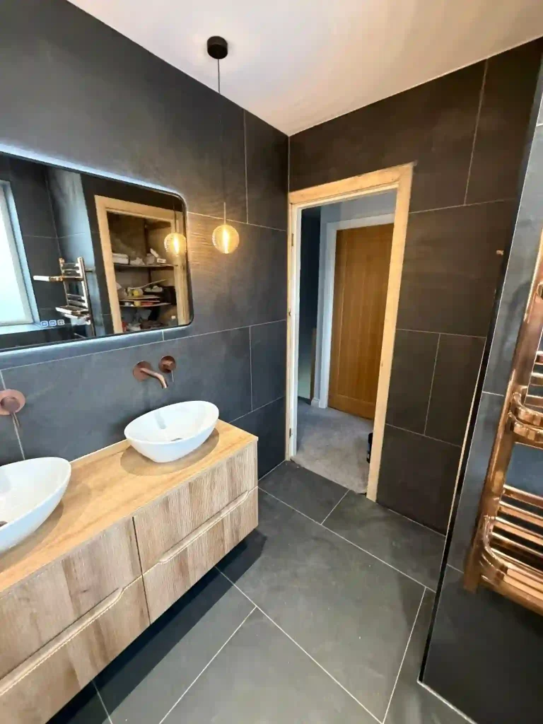 Bathroom with newly fiite lighting and raditators